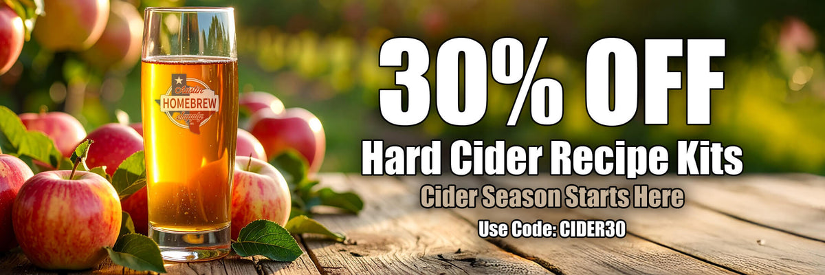 Promotional banner for hard cider recipe kits with a glass of cider and apples on a wooden table.