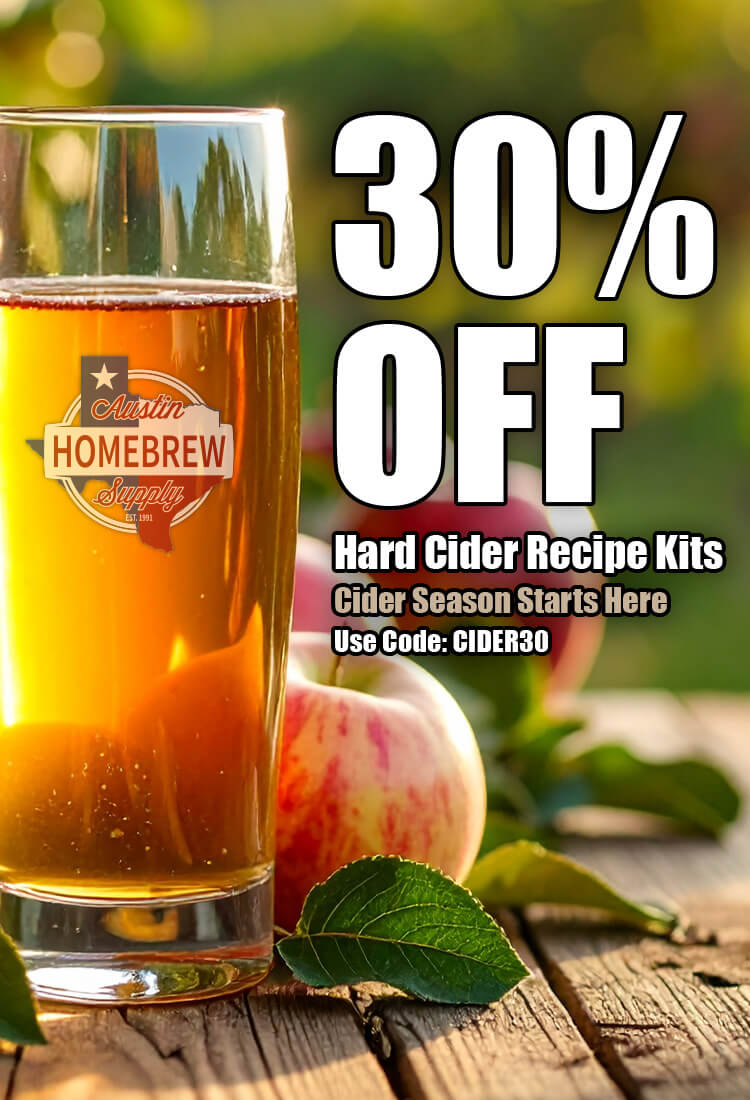 Glass of hard cider with apples on a wooden surface, featuring a promotion for hard cider recipe kits.