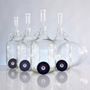 Four one-gallon fermentors, adhesive thermometers, screw caps, lengths of blowoff tubing, and airlocks