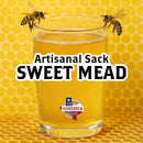 Glass of sweet mead with bees on a honeycomb background, featuring 'Artisan Sack Sweet Mead' text.