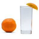 A glass of Navel Orange Hard Seltzer with an orange wedge.