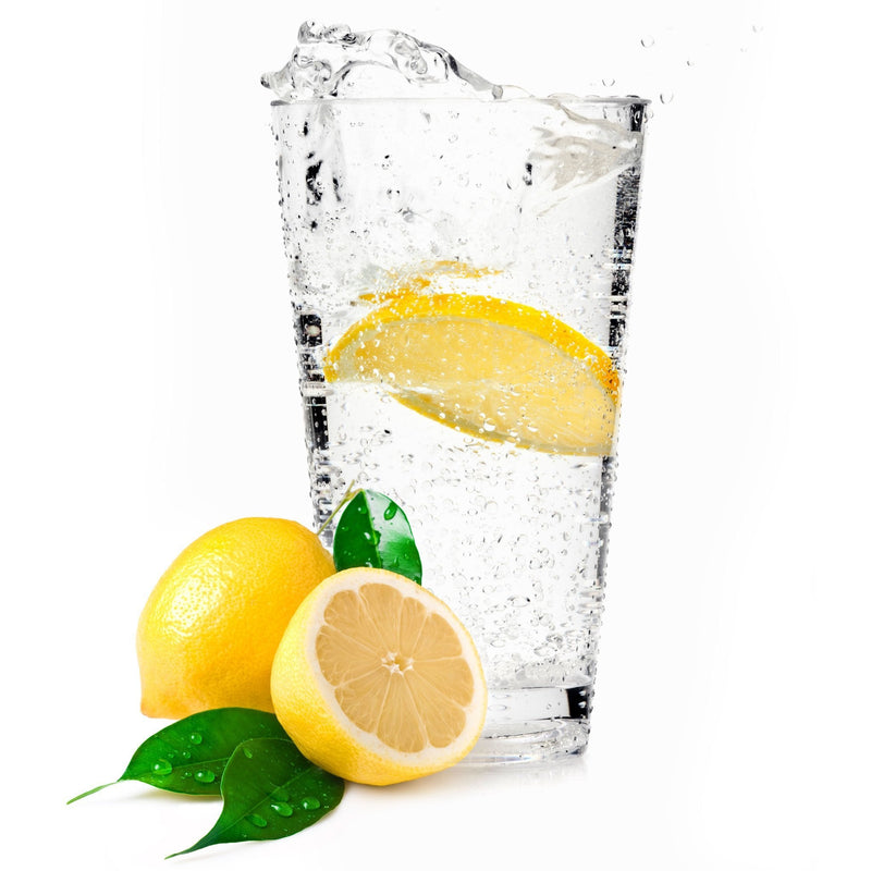 A glass of Lemon Hard Seltzer with a lemon wedge.