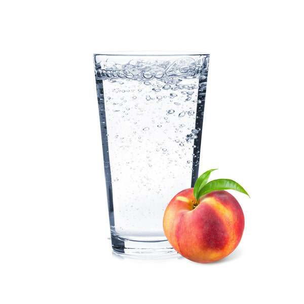 A glass of Peach Hard Seltzer with peach slices.