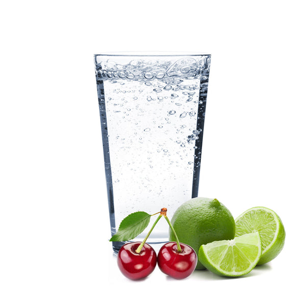 A glass of Cherry Lime Hard Seltzer with cherries and lime wedges.