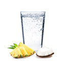 A glass of Pina Colada Hard Seltzer with pineapple and coconut.