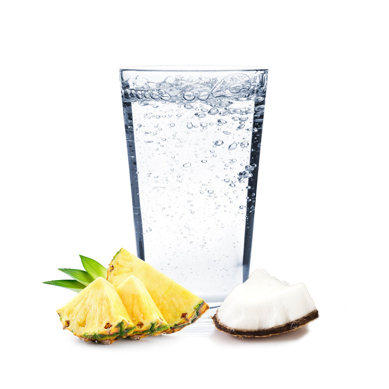 A glass of Pina Colada Hard Seltzer with pineapple and coconut.