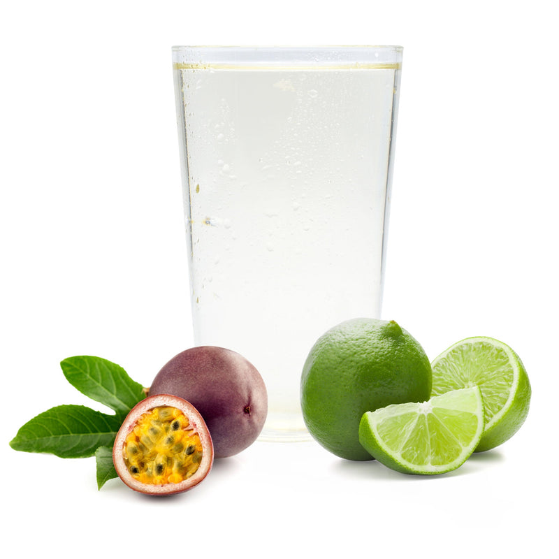 Refreshing tropical punch Ranch Water with passion fruit, lime, and vibrant citrus slices beside the glass.