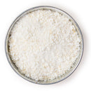 Pile of flaked torrefied rice in a small bowl.