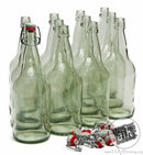 Set of clear glass bottles with metal clamps on a white background