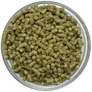 Contessa hop pellets in a glass bowl on a white background