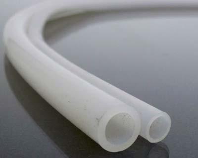 Two silicone tubes resting side by side, one larger than the other.